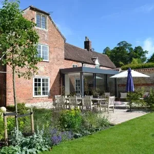 Glass extension in Wiltshire with slim framed sliding doors