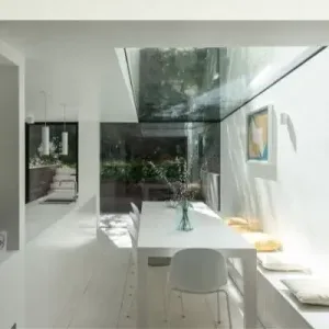 frameless roof glazing creating biophilic design in contemporary interior design
