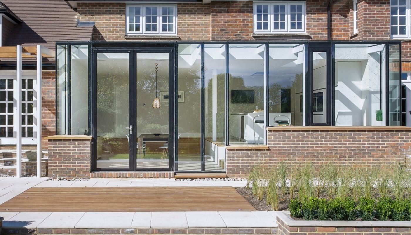 a glass orangery with modern glass