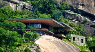 a cliffside house in zimbabwe by iq glass