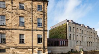 external view of glass link extension between old and new buildings at Bailiffgate hotel Alnwick