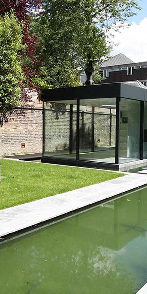 Glass box garden room in Chelsea London features slim frame