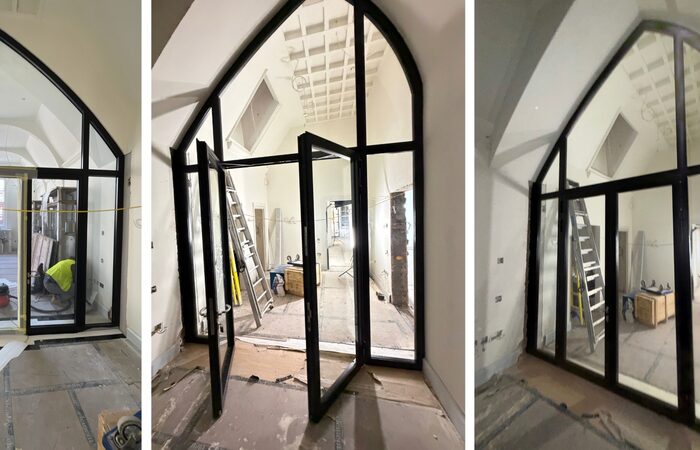 site images of a pointed arched or gothic arched fire rated screen in a partially completed state