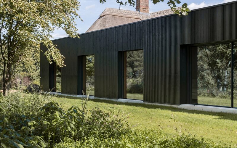 structural glazing with black charred wood cladding