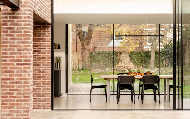 flush threshold sliding glass doors to a glazed extension in york shown with the sliding glass doors open