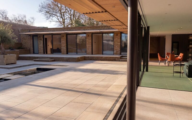 frameless sliding doors around an internal courtyard of a passive house build