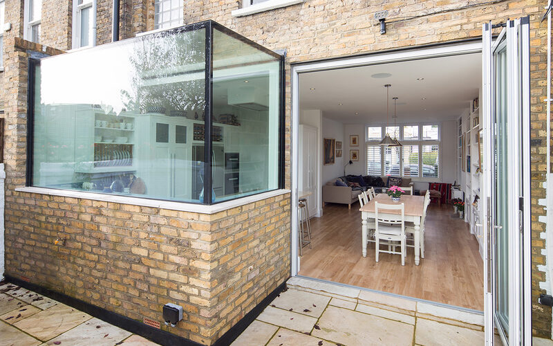 Exterior of a frameless oriel window above the kitchen sink at Thornton Road, Richmond