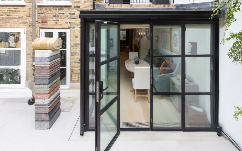 steel doors to a rear glass extension shown partially open