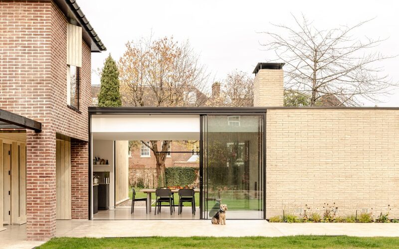 ultra thin sliding glass doors to a modern extension and glazed link in york. shown with the sliding doors open.
