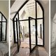 site images of a pointed arched or gothic arched fire rated screen in a partially completed state