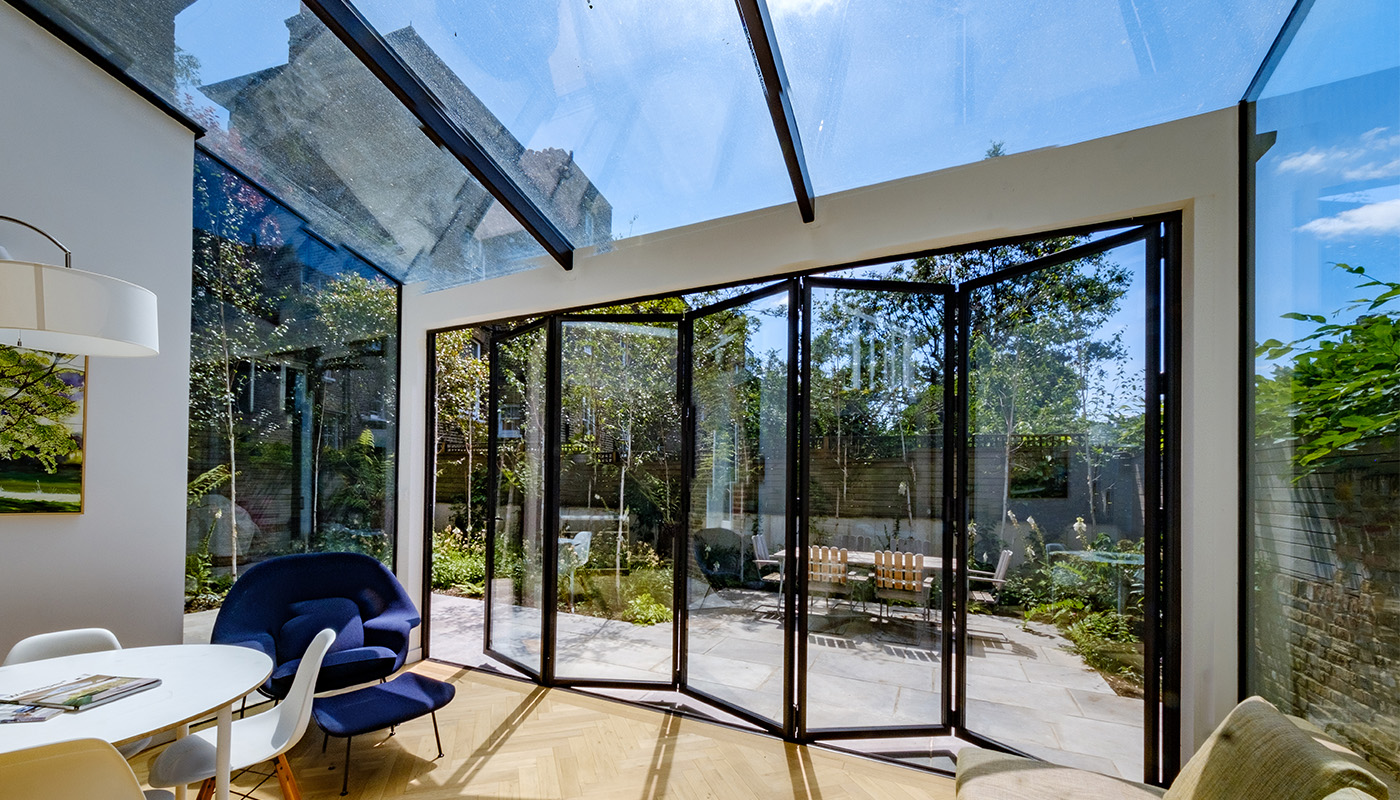 Glass extension with bi-fold doors